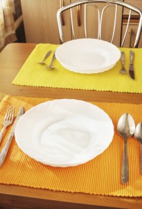 White plates with bright placemats