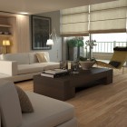 Living room with  beige sofa and chair and wood floors