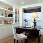 Dark wood desk in white study