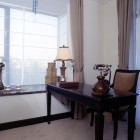 Dark wood desk by window