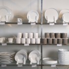 Retail display of porcelain dishes and mugs