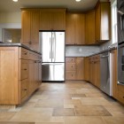 Kitchen in newly constructed house with tile floor