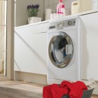 Compact and useful laundry room with a window